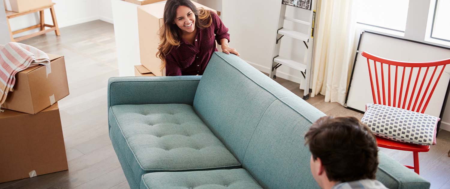 couple moving a couch for a short distance move